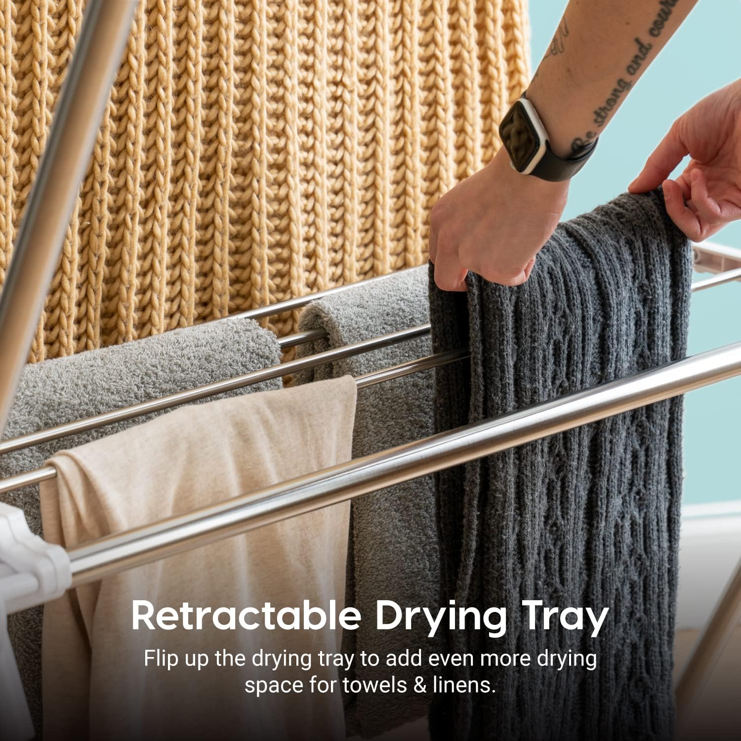 IRIS USA drying rack in use with shirts, socks, and towels drying efficiently