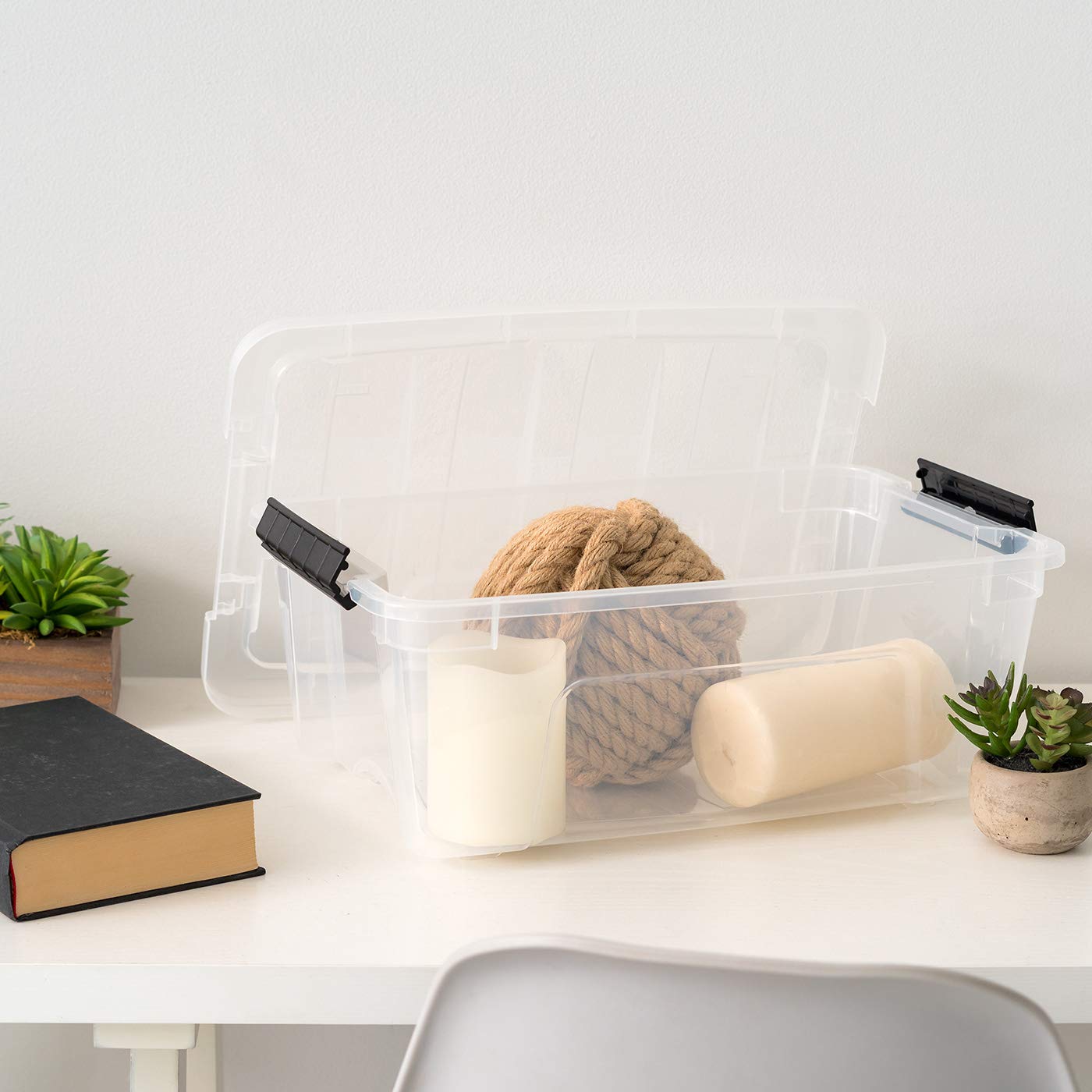 IRIS USA bins in a craft room showcasing tidy, accessible storage