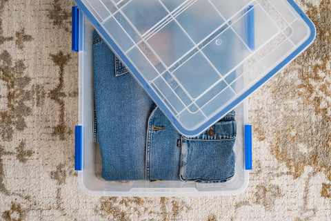 IRIS USA open bin filled with folded clothes illustrating clean, protected storage
