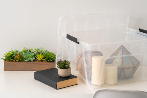 IRIS USA bin beside shoes to show size and capacity benefit