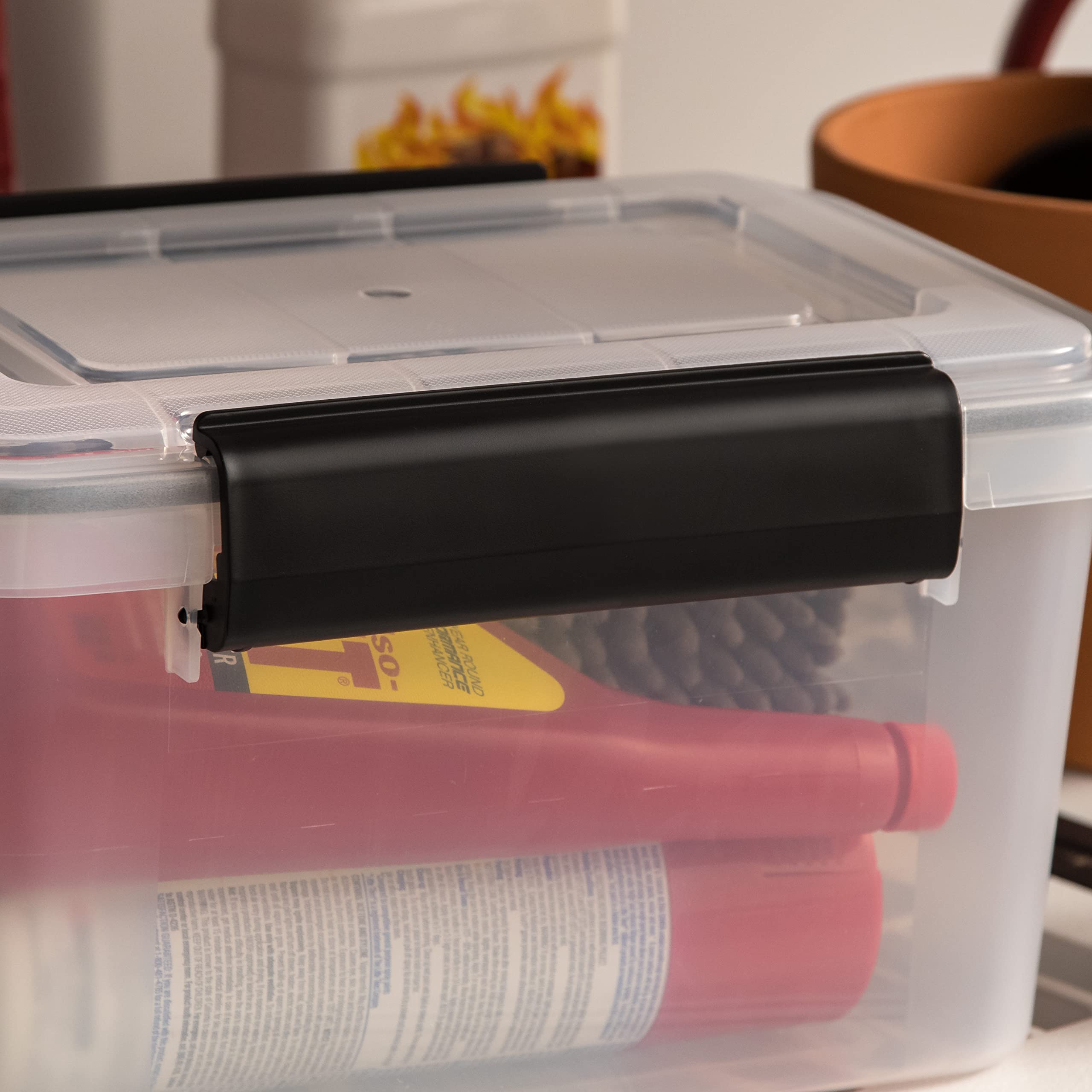 IRIS USA bin beside a notebook showing compact 6-quart size benefit
