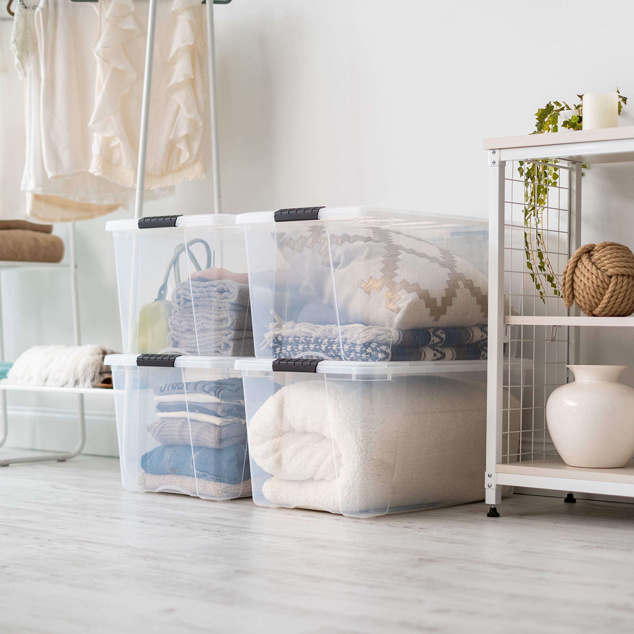 IRIS USA next to person demonstrating 72-quart scale for planning storage layout