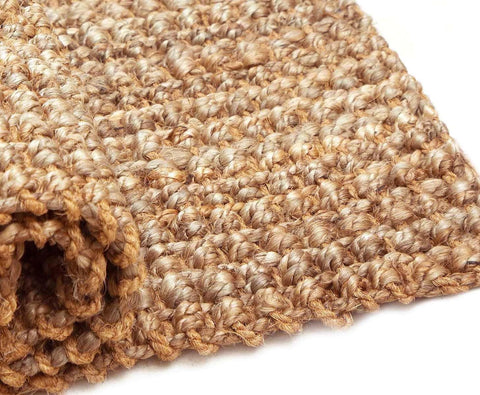 IRONGATE rug under coffee table shows layered styling and anchoring benefit