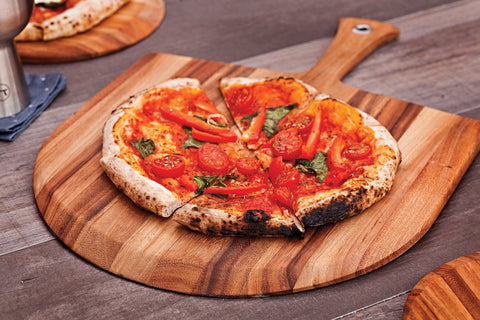 Ironwood Gourmet next to a baked pizza showing scale and generous 14x20 size