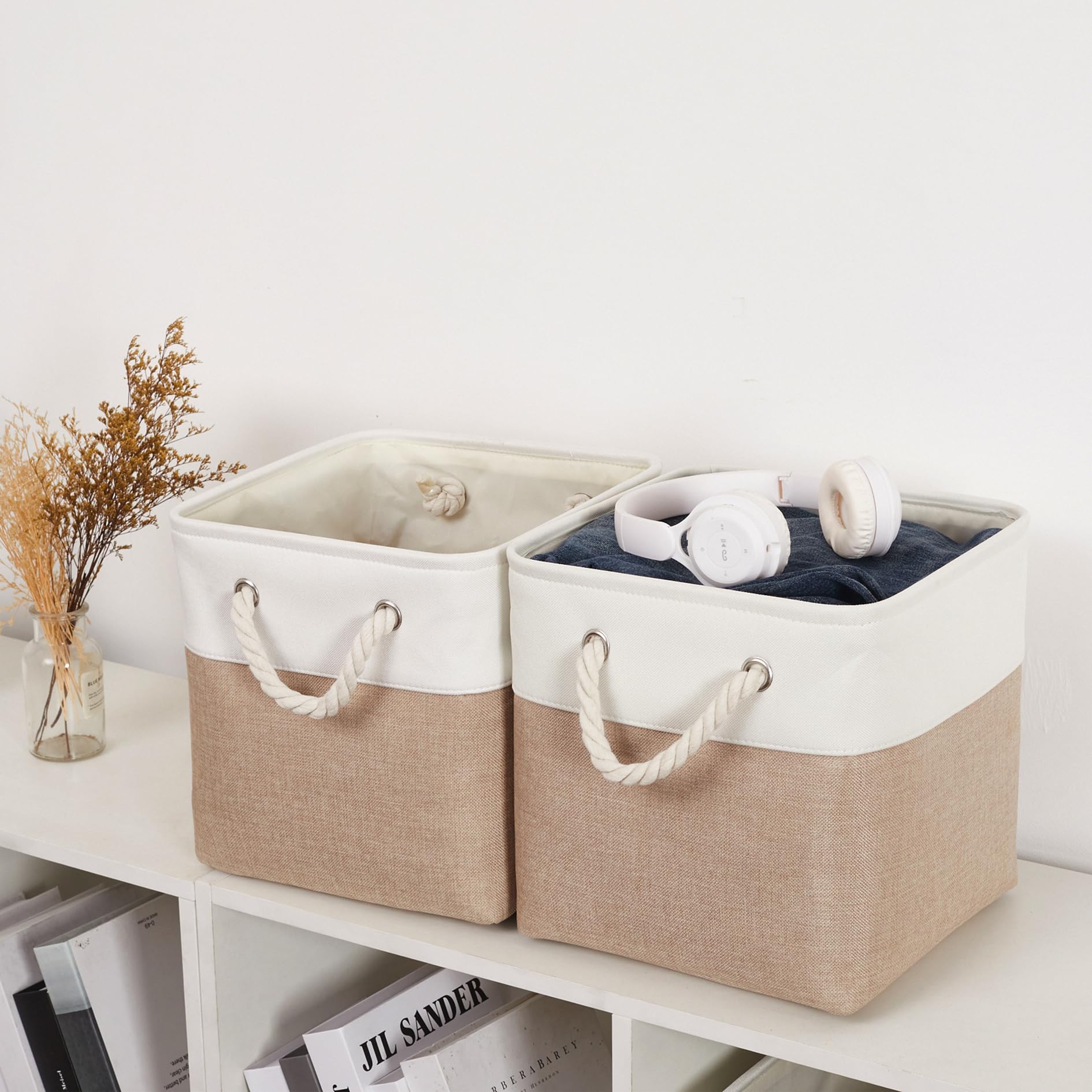 ISEMINGLA cube beside books demonstrating size fit for standard shelves and capacity