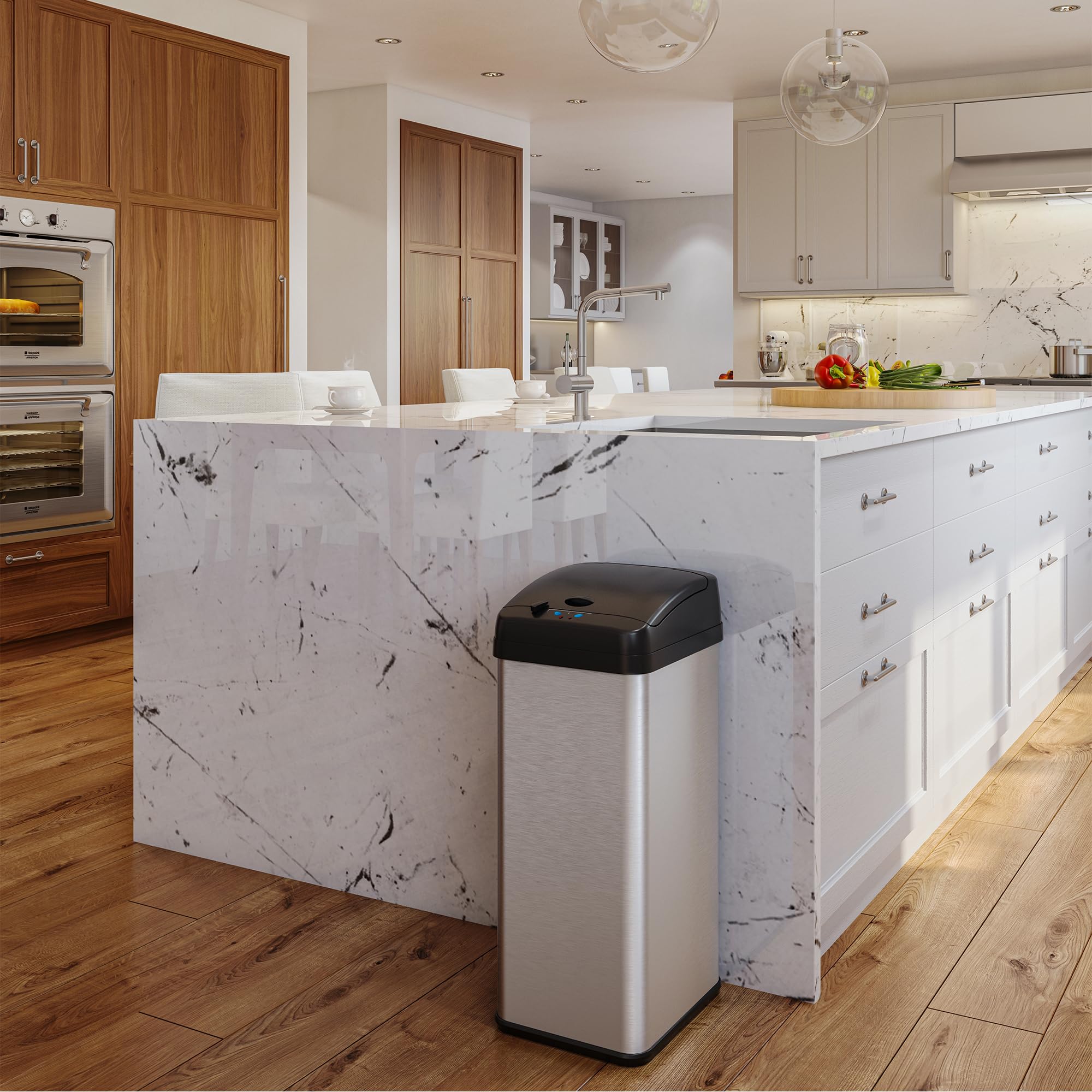 iTouchless next to kitchen counter showing 13 gallon capacity and space-saving shape