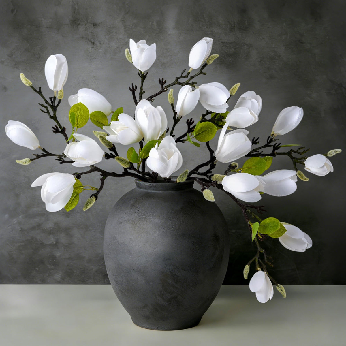 Ivydale front view of five white magnolia stems showing elegant arrangement benefit