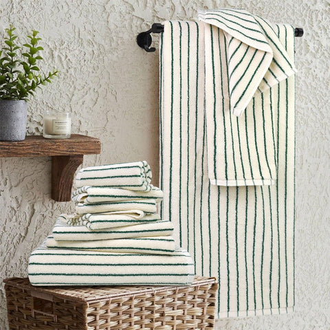 Jacquotha bath towel folded to show plushness and absorbent cotton feel