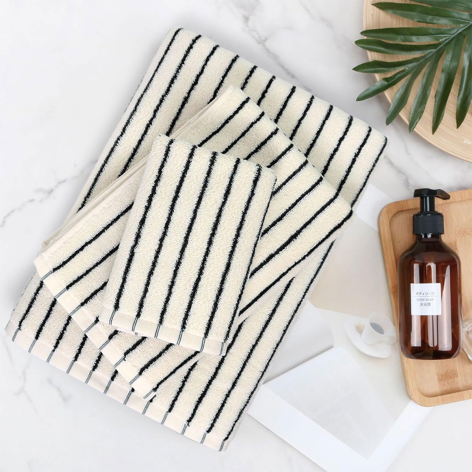 Jacquotha towels styled in a bathroom offering a modern, coordinated decor benefit