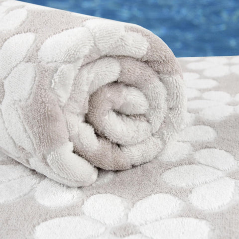 Jacquotha towel on beach showing versatile use and easy portability