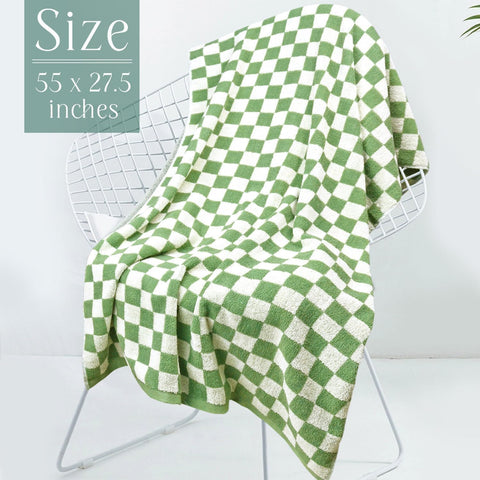 Jacquotha folded towels next to ruler illustrating 55 x 27.5 inch size and wrapability