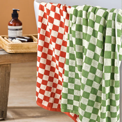 Jacquotha towel draped in bathroom showing decorative checkered style and quick-dry use