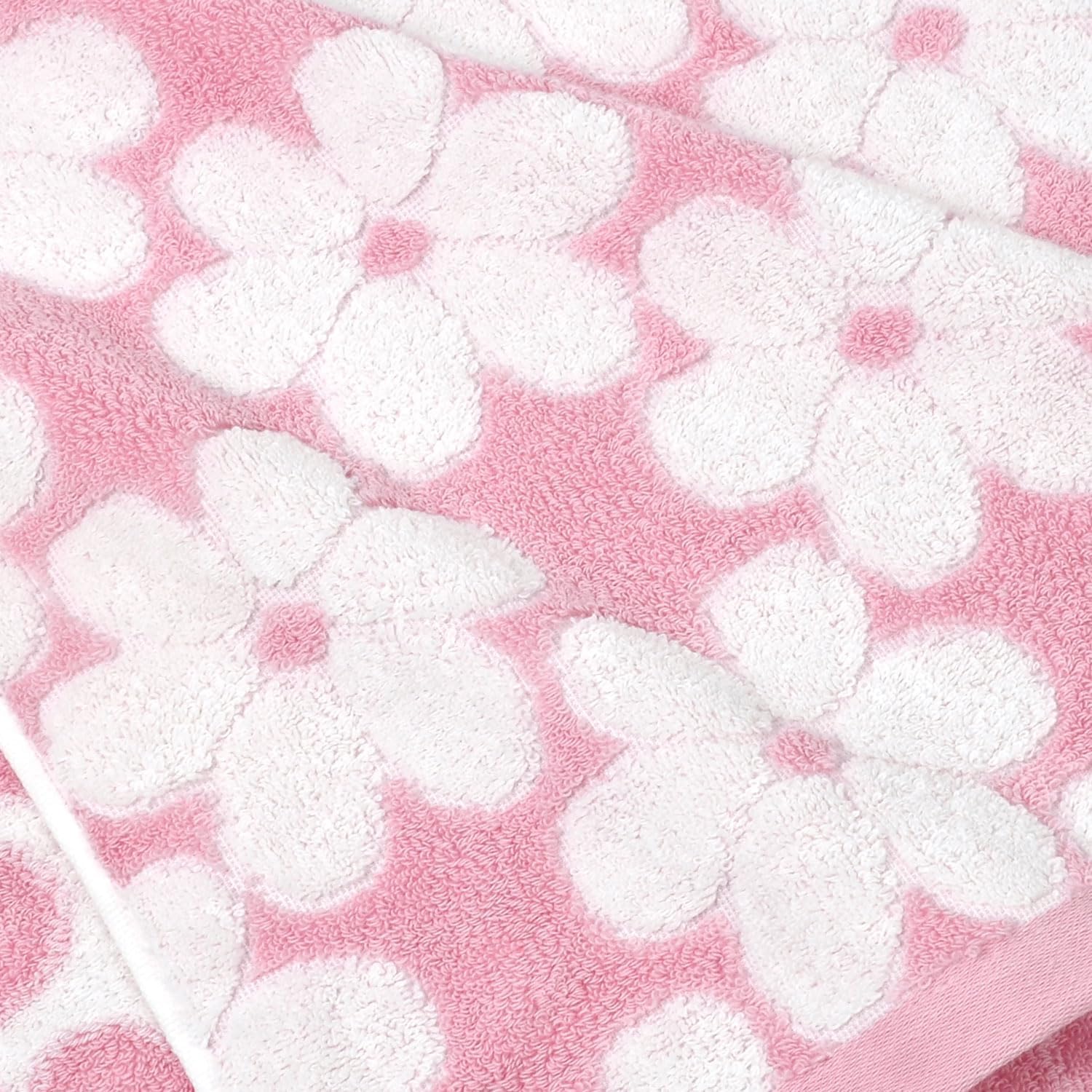 Jacquotha folded towels on shelf showing neat storage and décor benefit