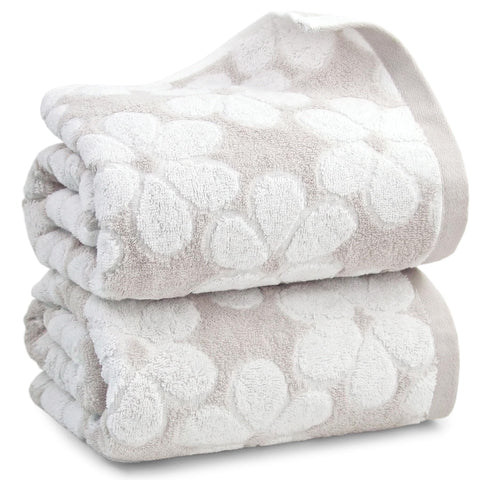 Jacquotha folded towels front view showing neat stack and inviting softness