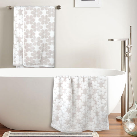 Jacquotha towel beside ruler illustrating 27.5 x 55 inches generous size