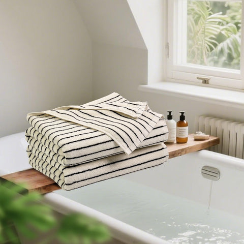 Jacquotha folded towel on shelf, neat storage and decorative appeal