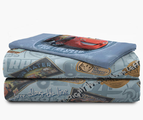 Jay Franco bedroom scene with Cars bedding staged for playful sleepover inspiration