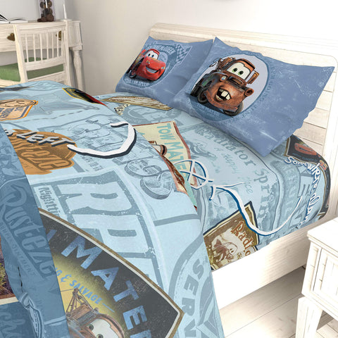 Jay Franco Cars rolled bedding in suitcase showing compact transport and travel-friendly packing