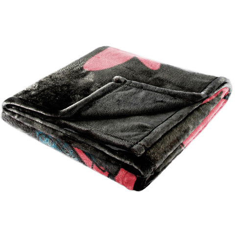 Jay Franco folded throw next to ruler showing 50x70 inch size and easy storage