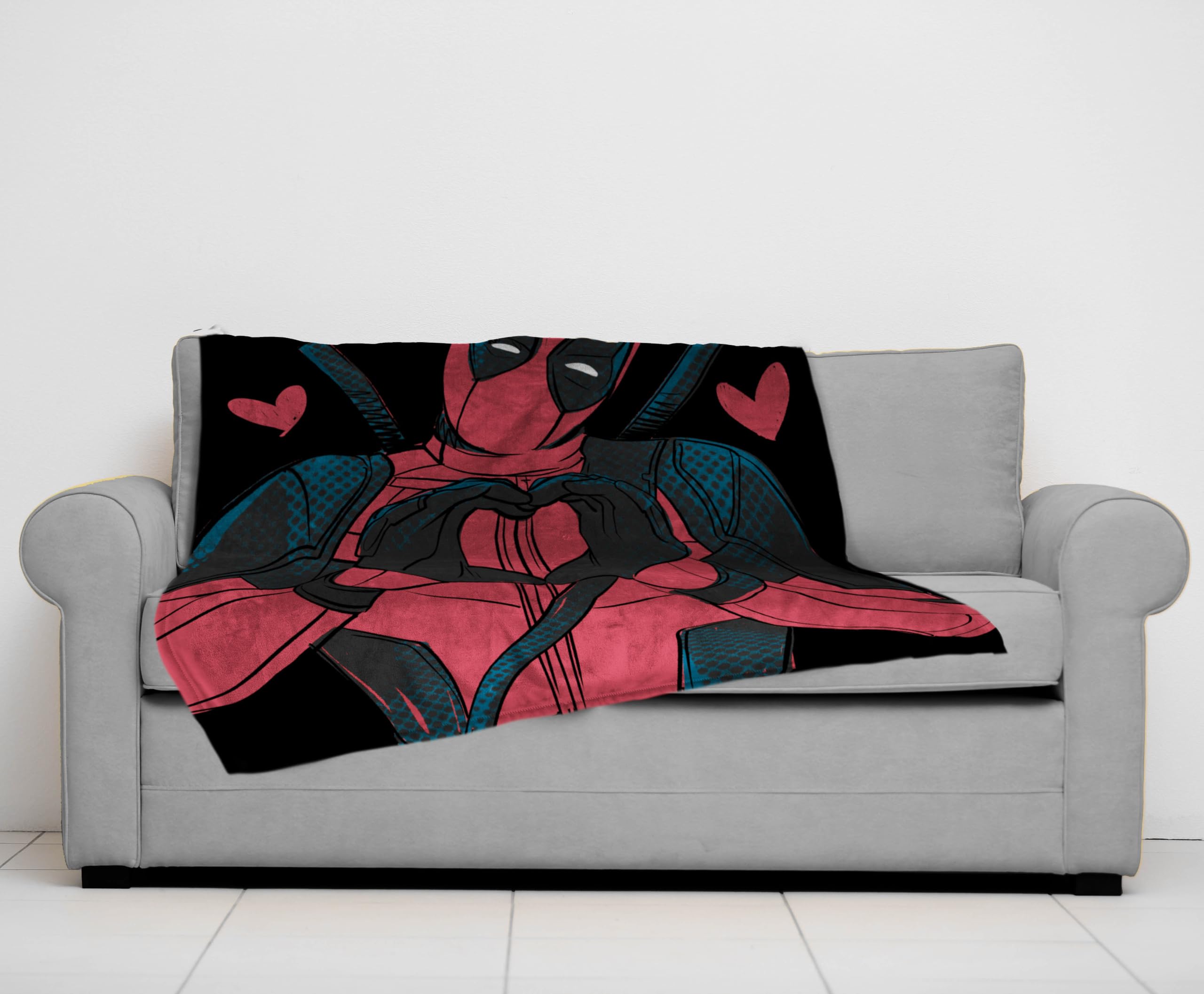 Jay Franco Deadpool throw spread over couch showing coverage and stylish living room accent