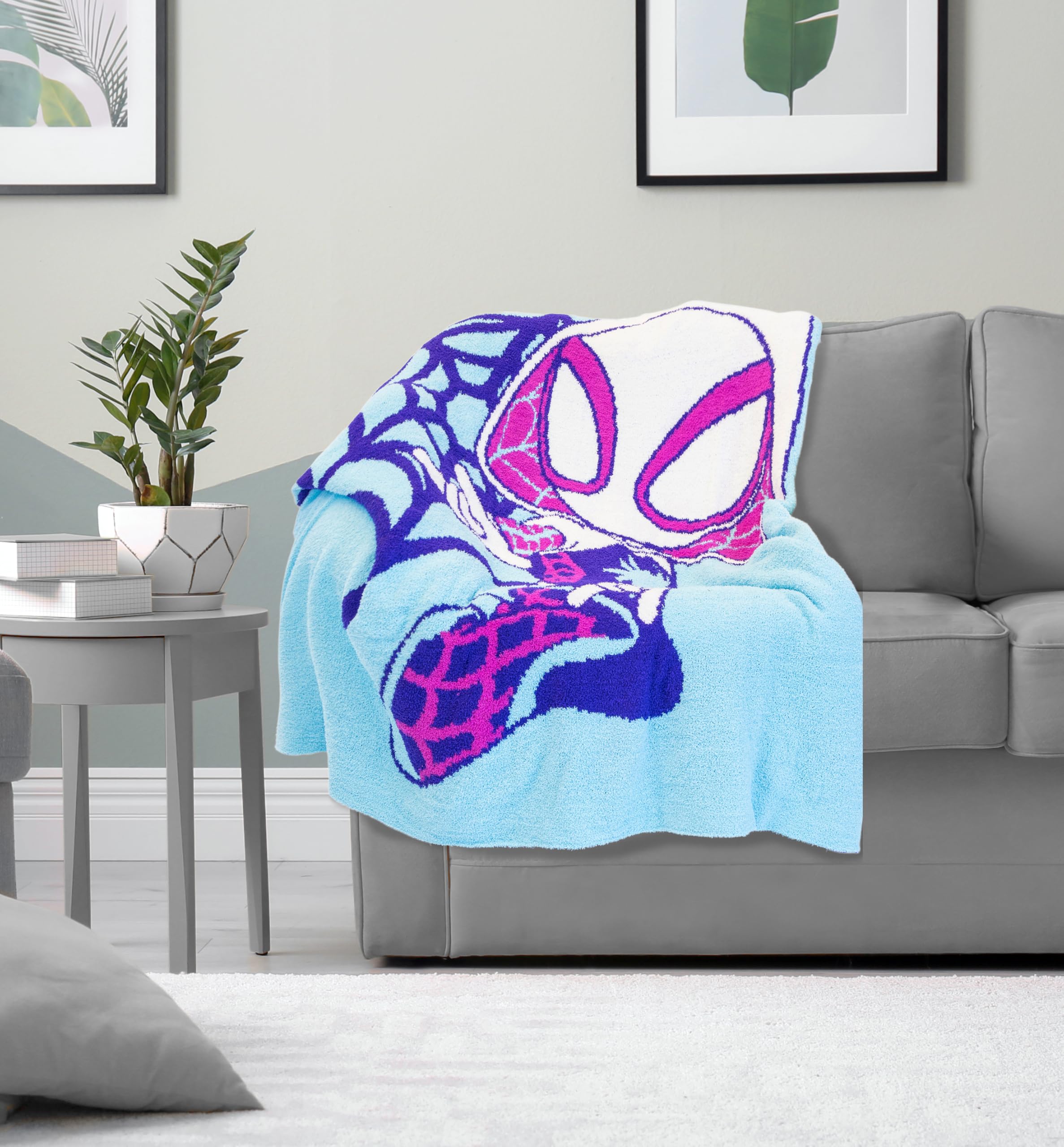 Jay Franco folded throw on couch conveying scale and easy storage