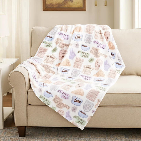 Jay Franco close-up of plush fleece pattern showing vibrant Stars Hollow icons