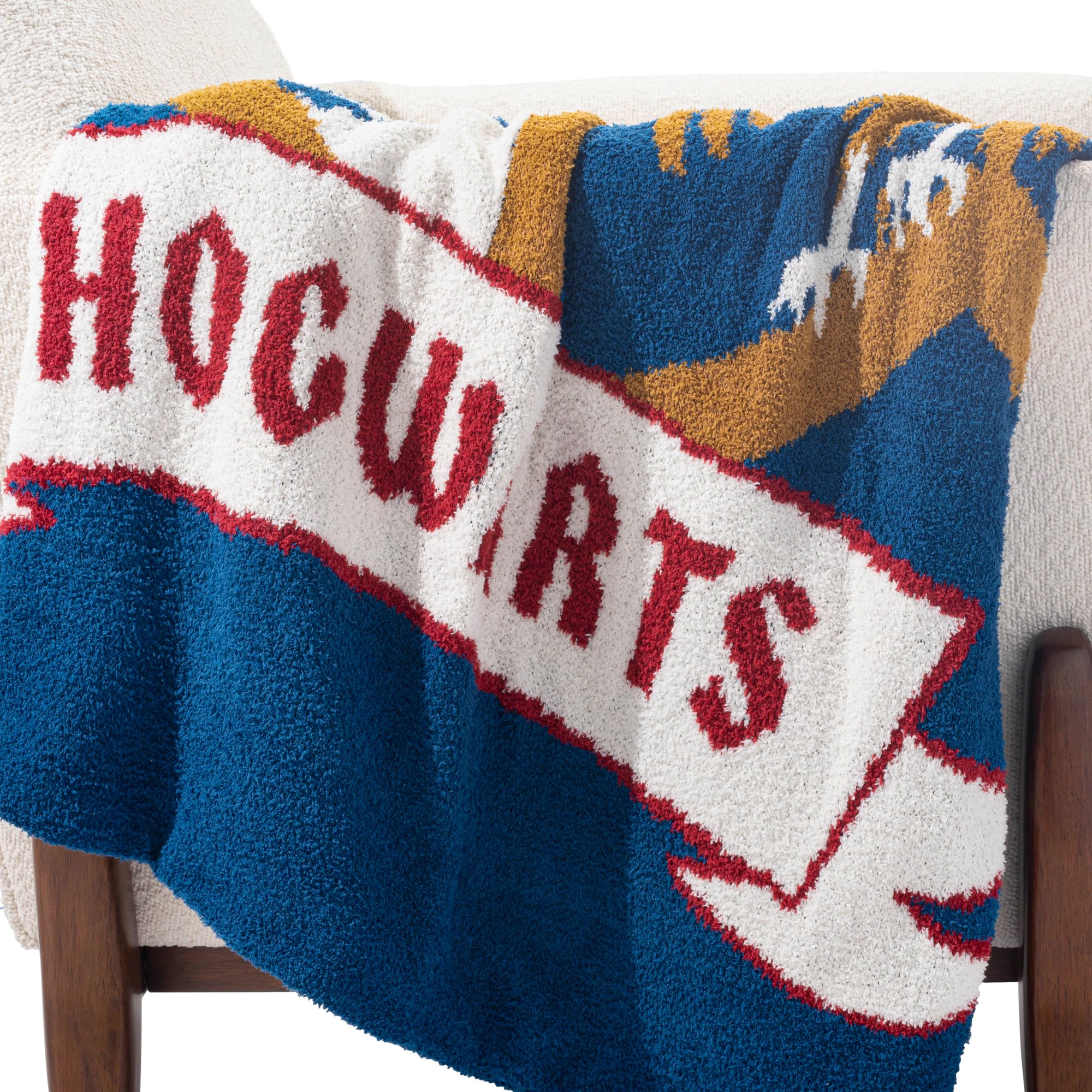 Jay Franco blanket draped on sofa in living room showing stylish fandom décor benefit