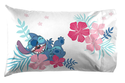 Jay Franco flat sheet spread across bed highlighting island-themed Stitch artwork