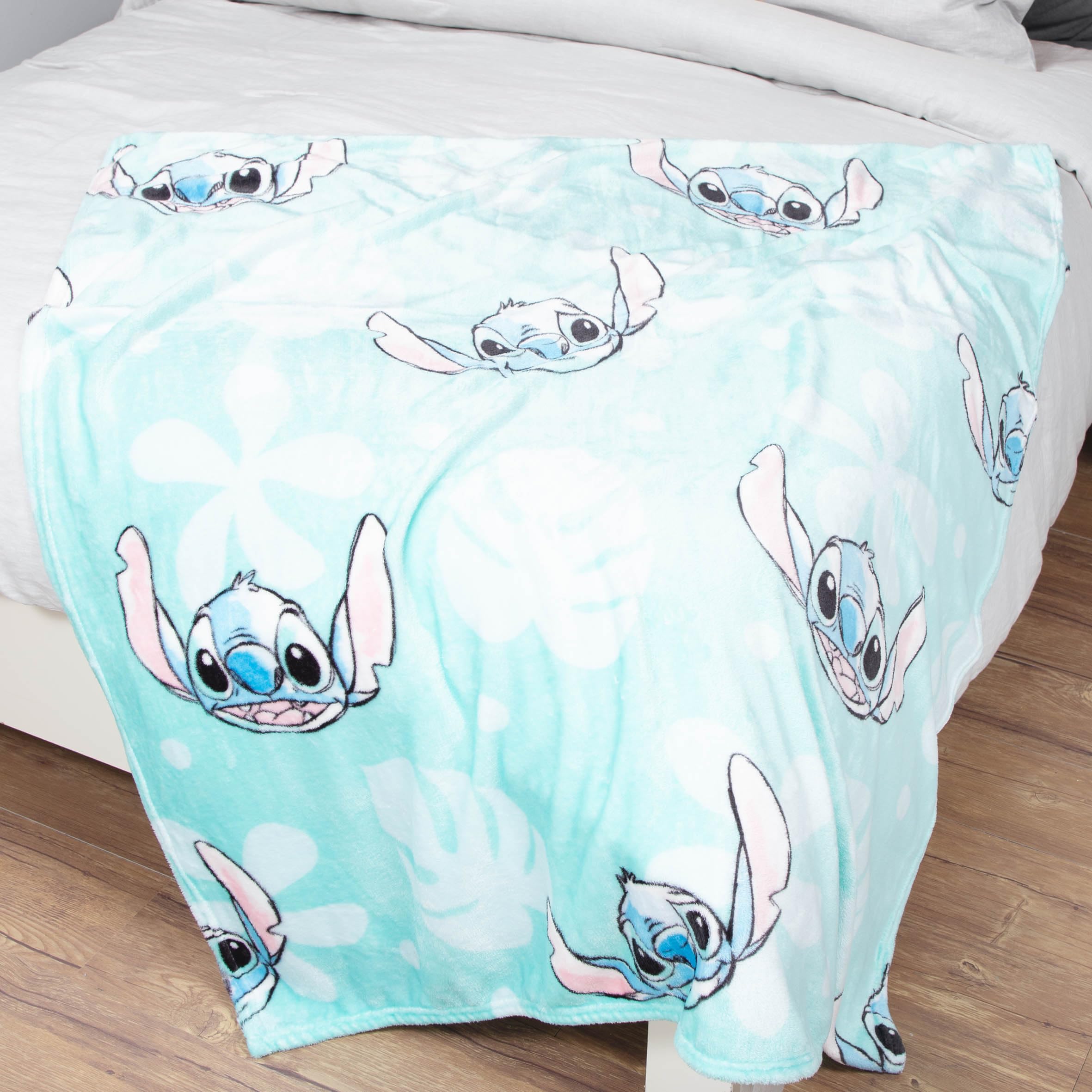 Jay Franco Lilo & Stitch blanket next to bed showing actual size and easy layering benefit