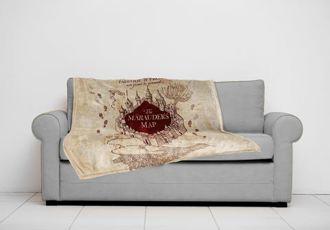 Jay Franco throw next to a pillow showing 50x70 scale for gifting and room planning