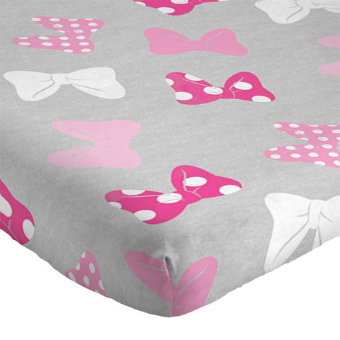 Jay Franco Minnie Mouse comforter side drape showing thickness and edge finish