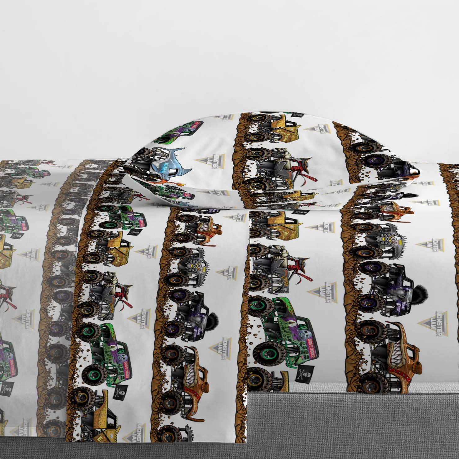 Jay Franco flat sheet spread on bed displaying full Monster Jam artwork and coverage