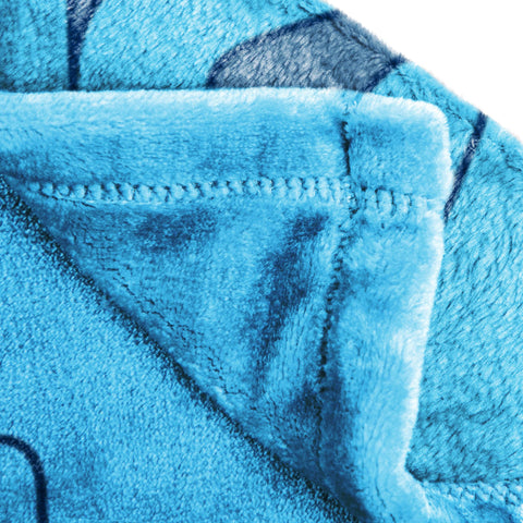 Jay Franco Stitch throw displayed on sofa adding colorful decor and warmth