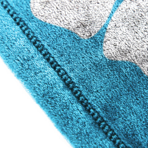 Jay Franco Stitch throw draped over bed showing full 60x90 coverage benefit