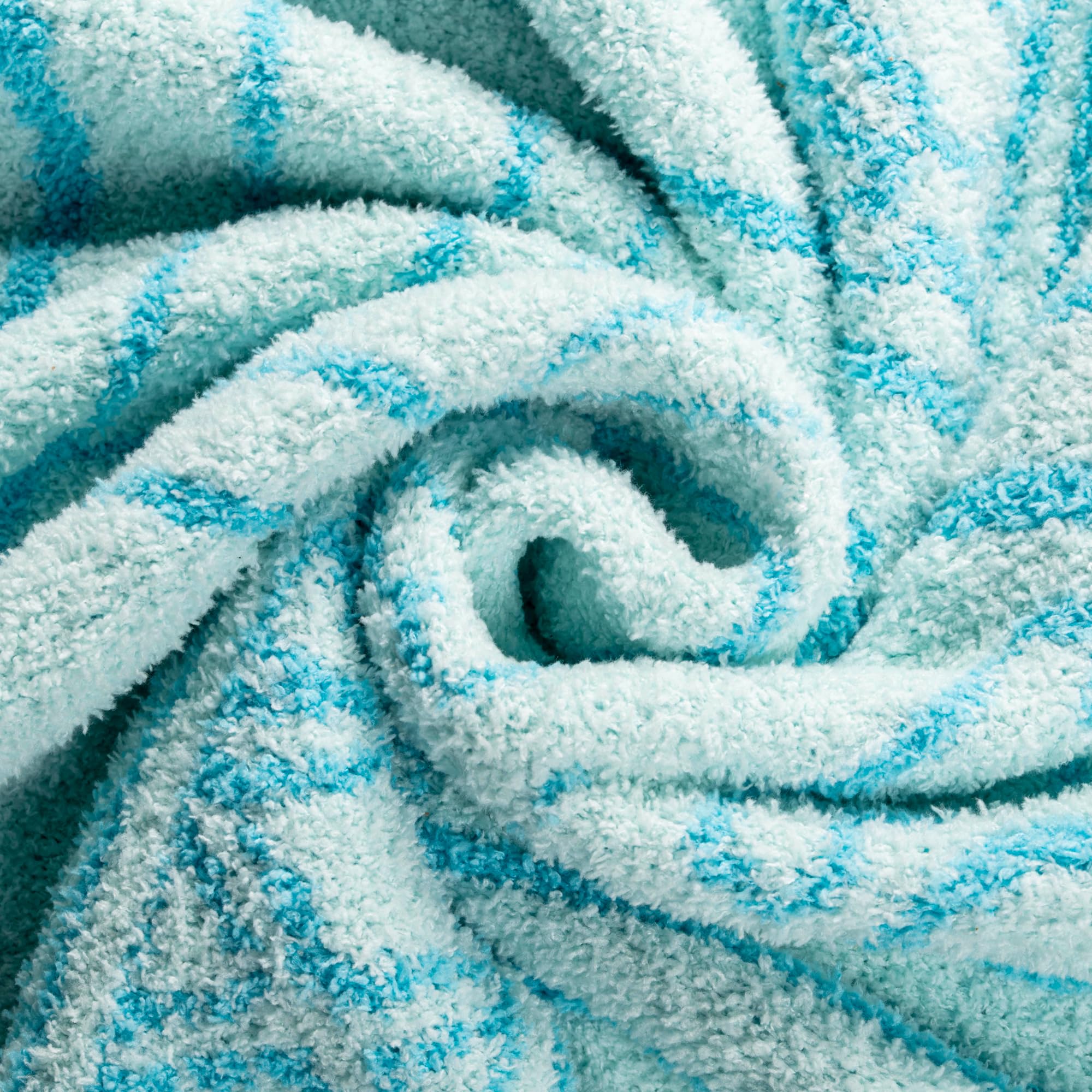 Jay Franco throw blanket draped on sofa demonstrating warmth and living room styling