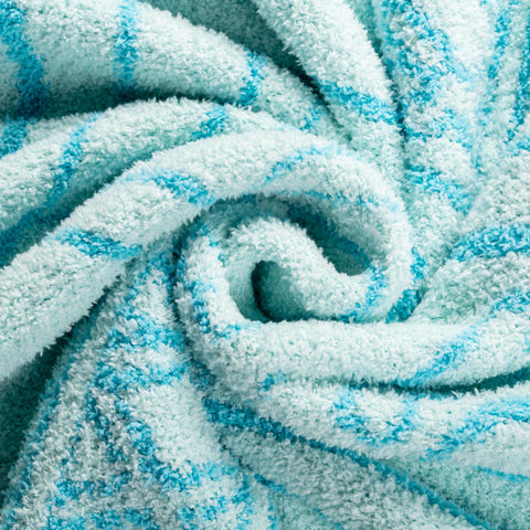 Jay Franco throw blanket draped on sofa demonstrating warmth and living room styling