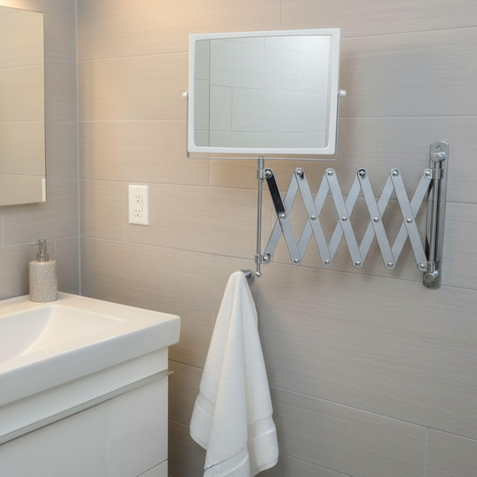 JERDON mirror with hand for scale showing compact size and easy maneuverability