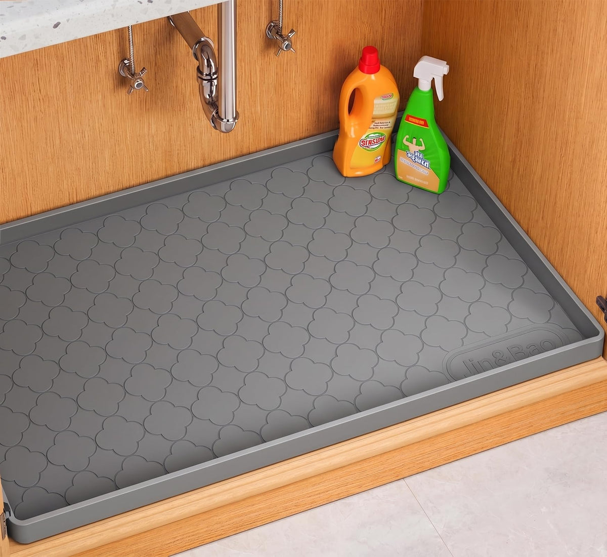 Jin&Bao front view of 31x19 silicone mat protecting cabinet floor and organizing items