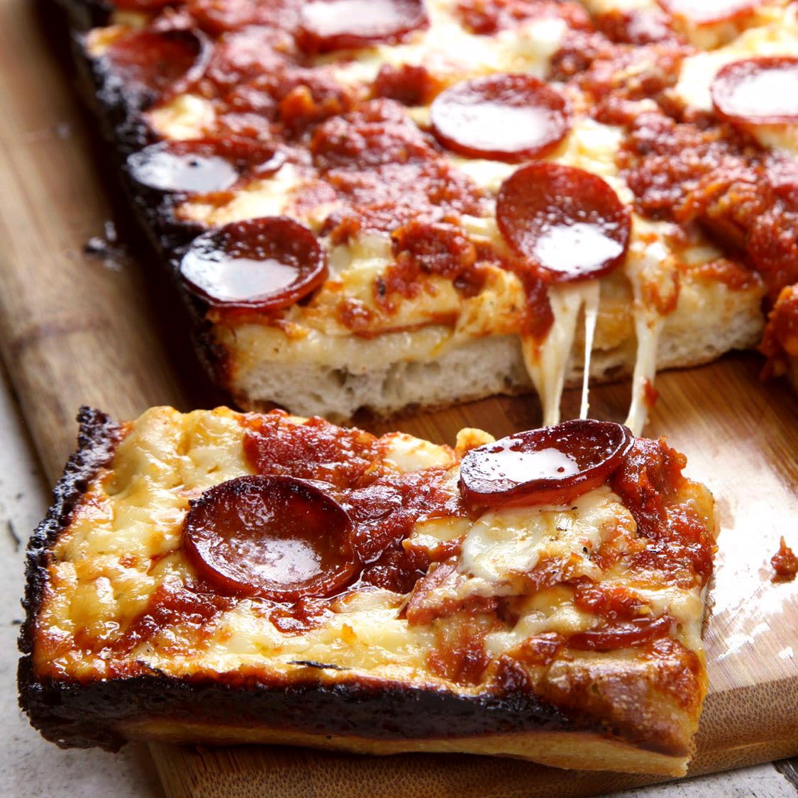 Jisculo pan on kitchen counter in lifestyle scene inspiring home pizza nights