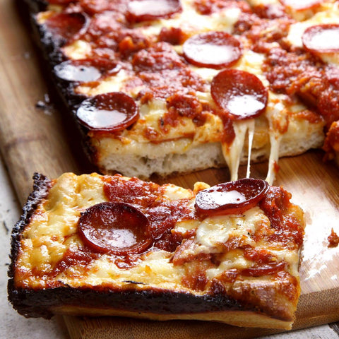 Jisculo pan on kitchen counter in lifestyle scene inspiring home pizza nights