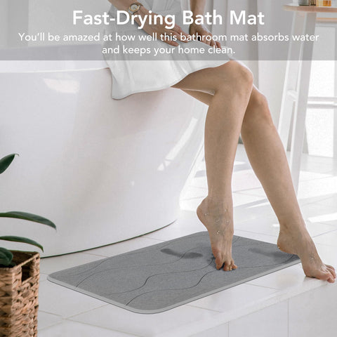 JIZEUO mat placed on a shower floor illustrating quick drying and reduced slipping benefit