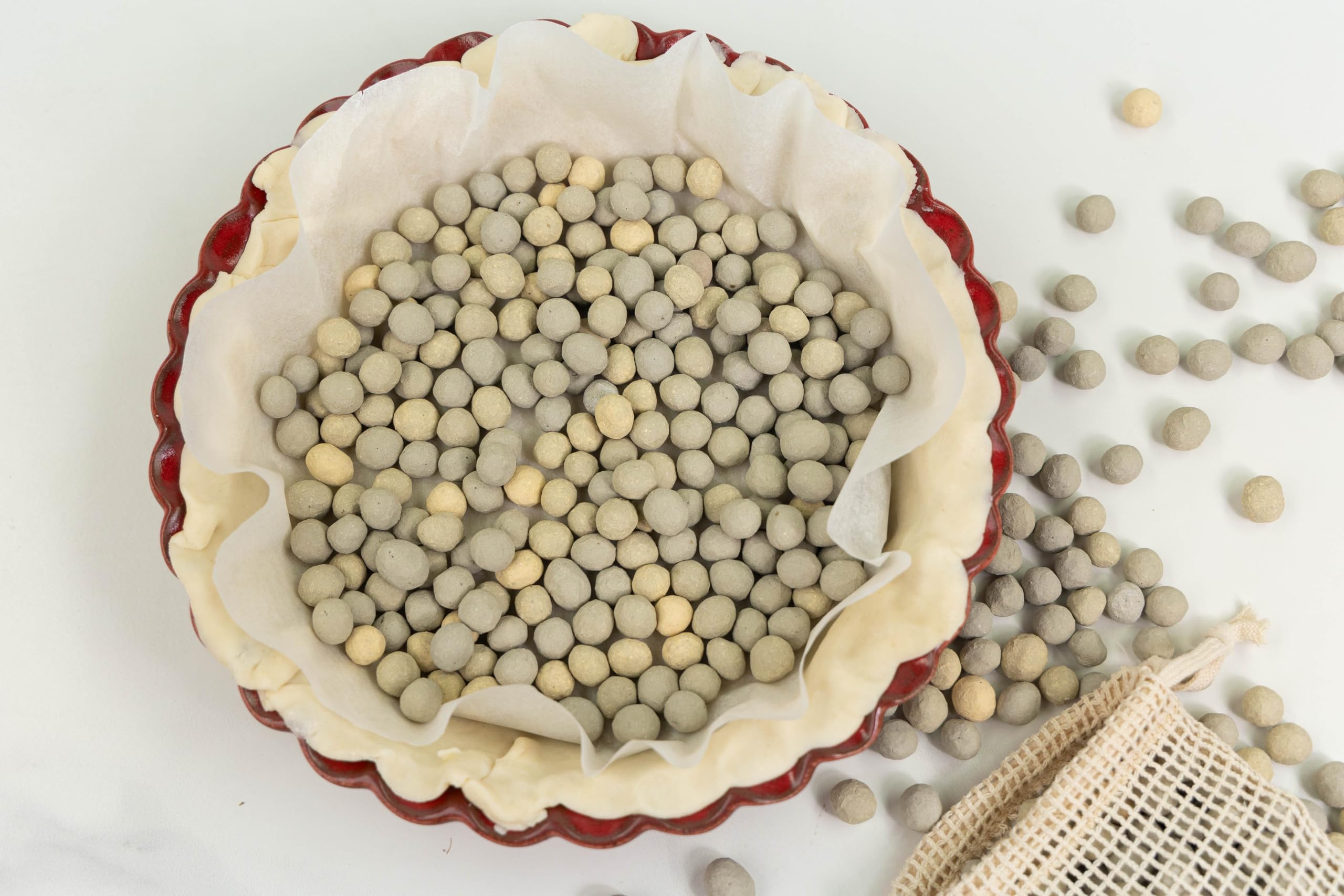 JJ Potts lifestyle image of pie and tart on table with beads bag conveying artisan quality