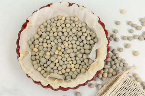JJ Potts lifestyle image of pie and tart on table with beads bag conveying artisan quality