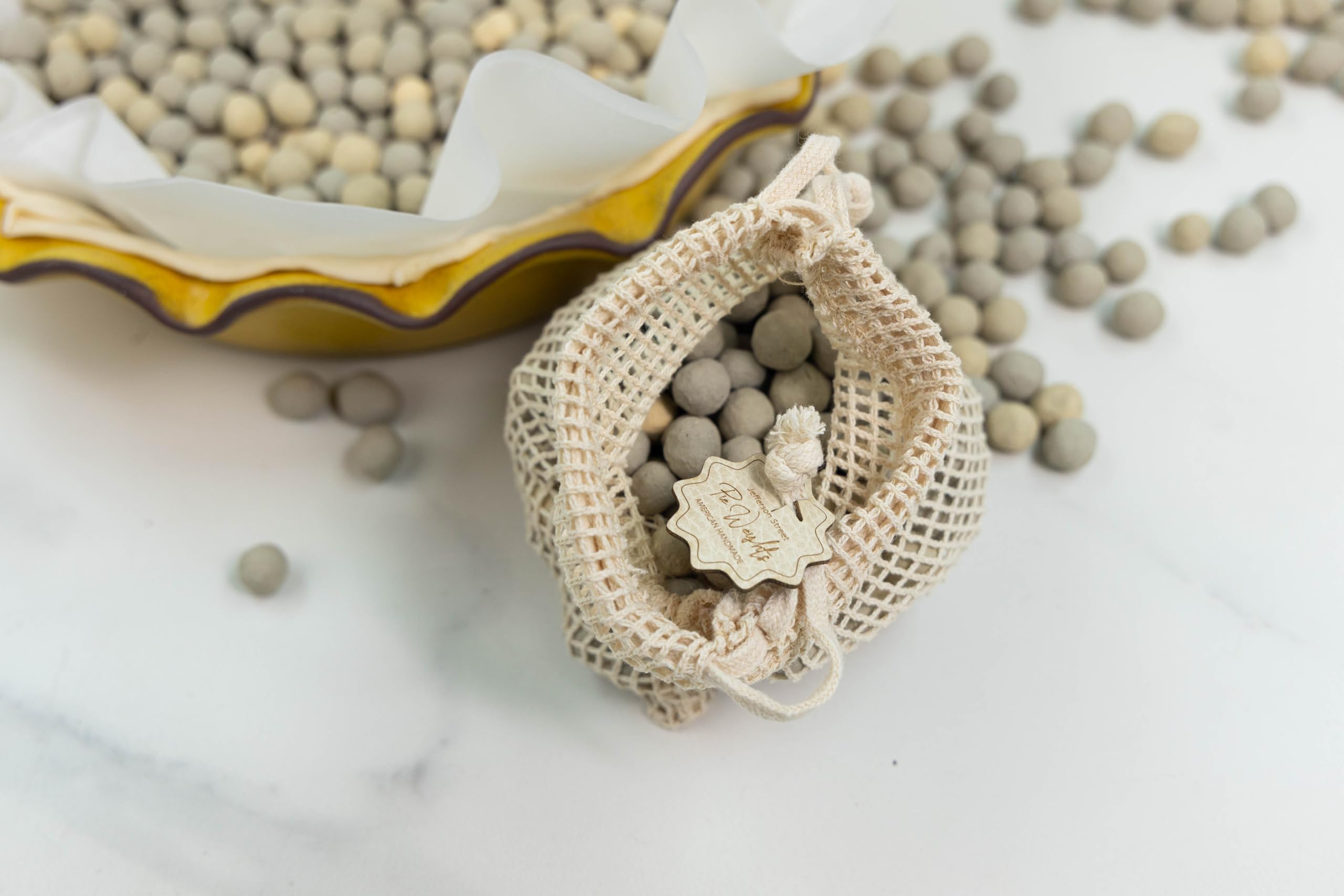 JJ Potts beads filling a 10-inch pie dish to prevent bubbling and keep crust flat