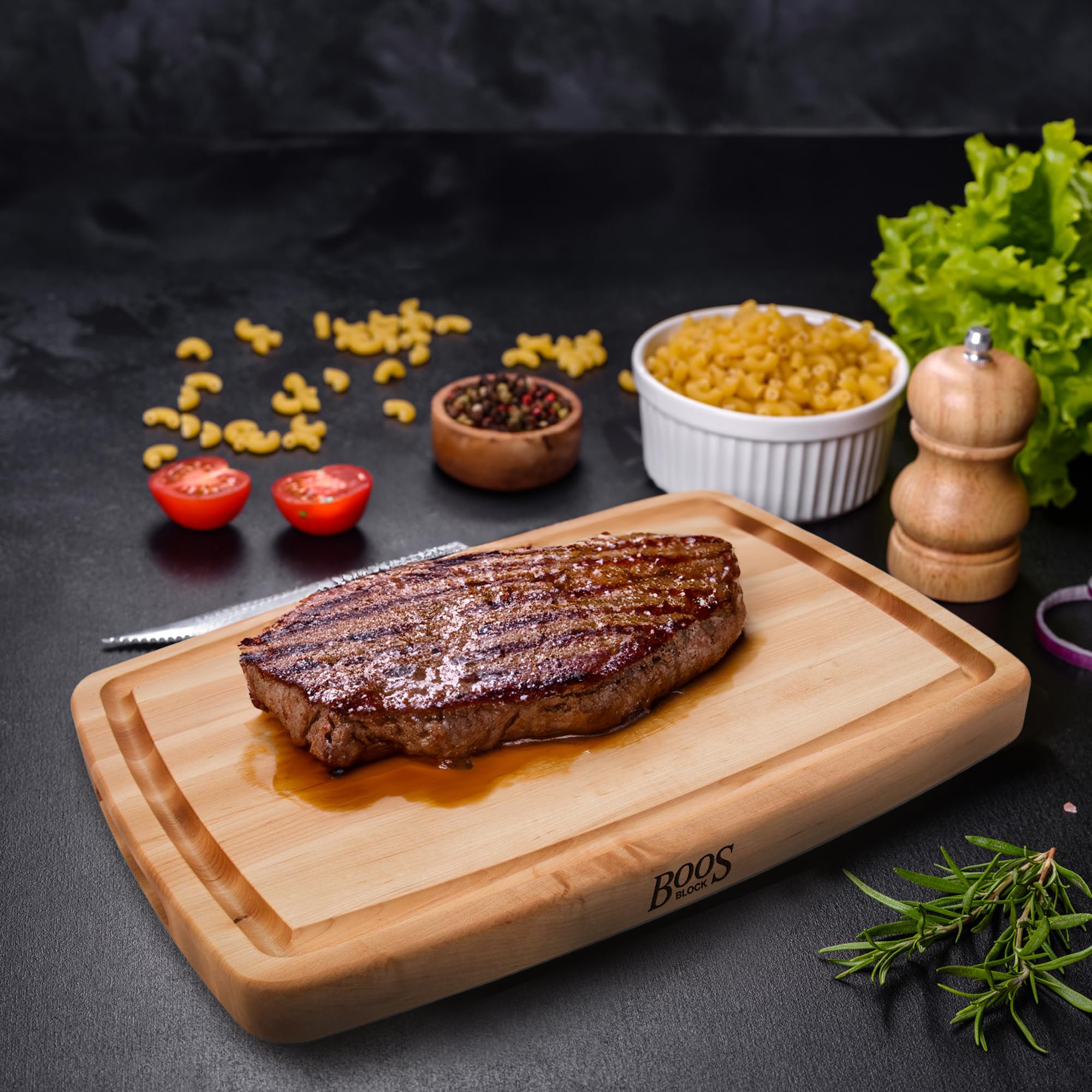 John Boos board beside sheet pan showing 20x14 size and scale advantage