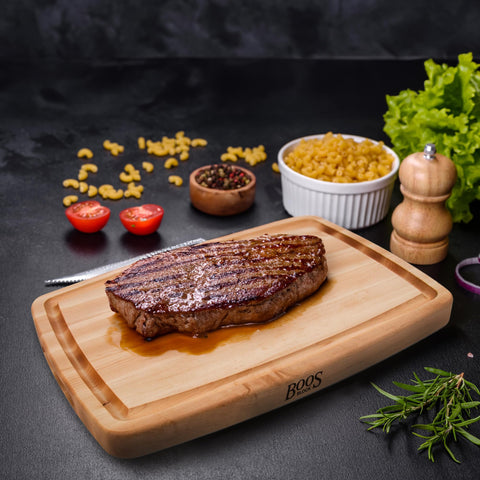 John Boos board beside sheet pan showing 20x14 size and scale advantage