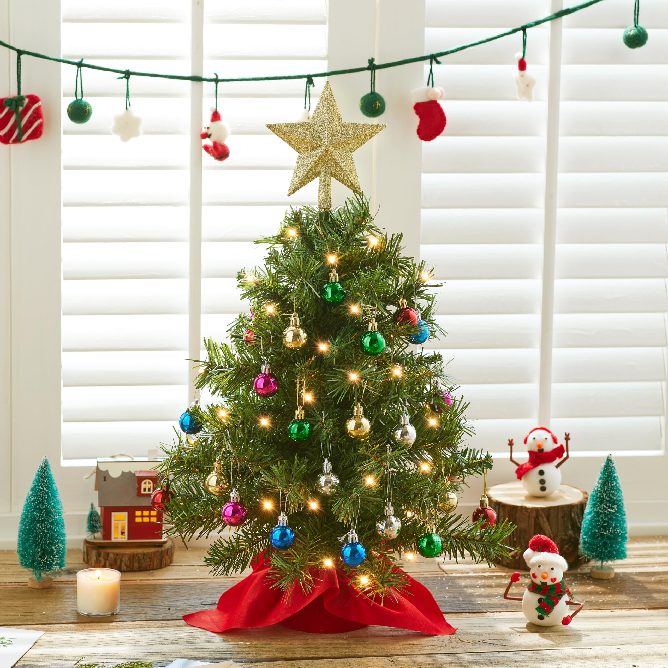 Joiedomi assortment of 24 mini ornaments laid out showing decoration variety benefit