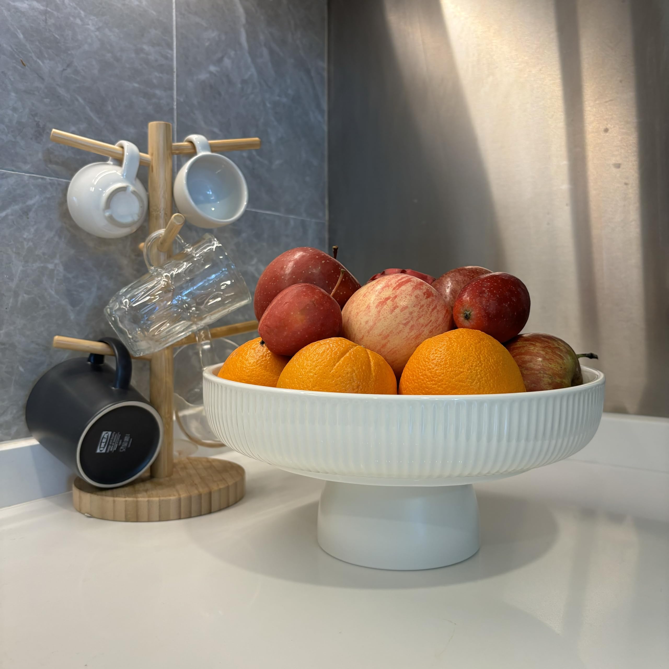 JolieJulie size comparison with apple and spoon showing real-world scale and usefulness