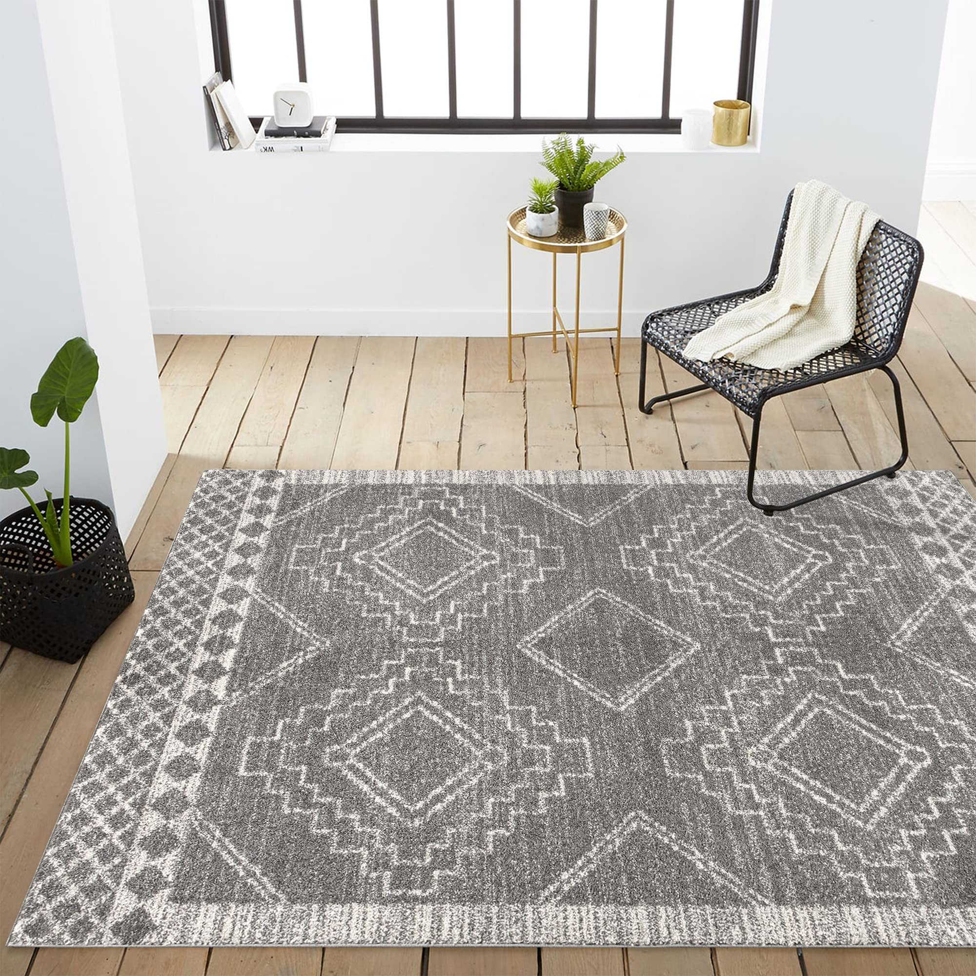 JONATHAN Y rug layered in bedroom creating cozy, low-profile bedside area
