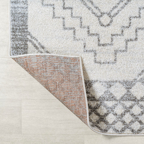 JONATHAN Y rug styled in bedroom showing softness and design anchoring bedside furniture